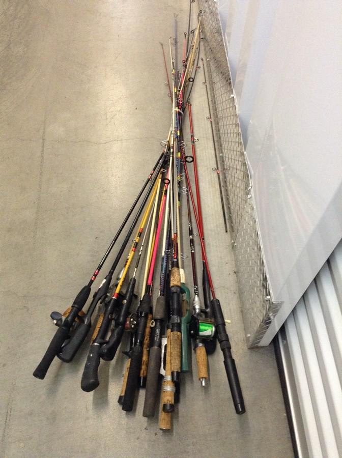 large lot of fishing polls, most with reels (1 of 1)