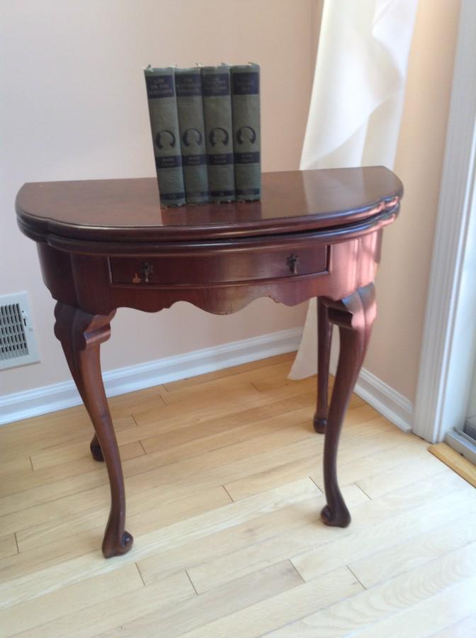 1/2 moon end table w/4 Marc Twain books (1 of 1)