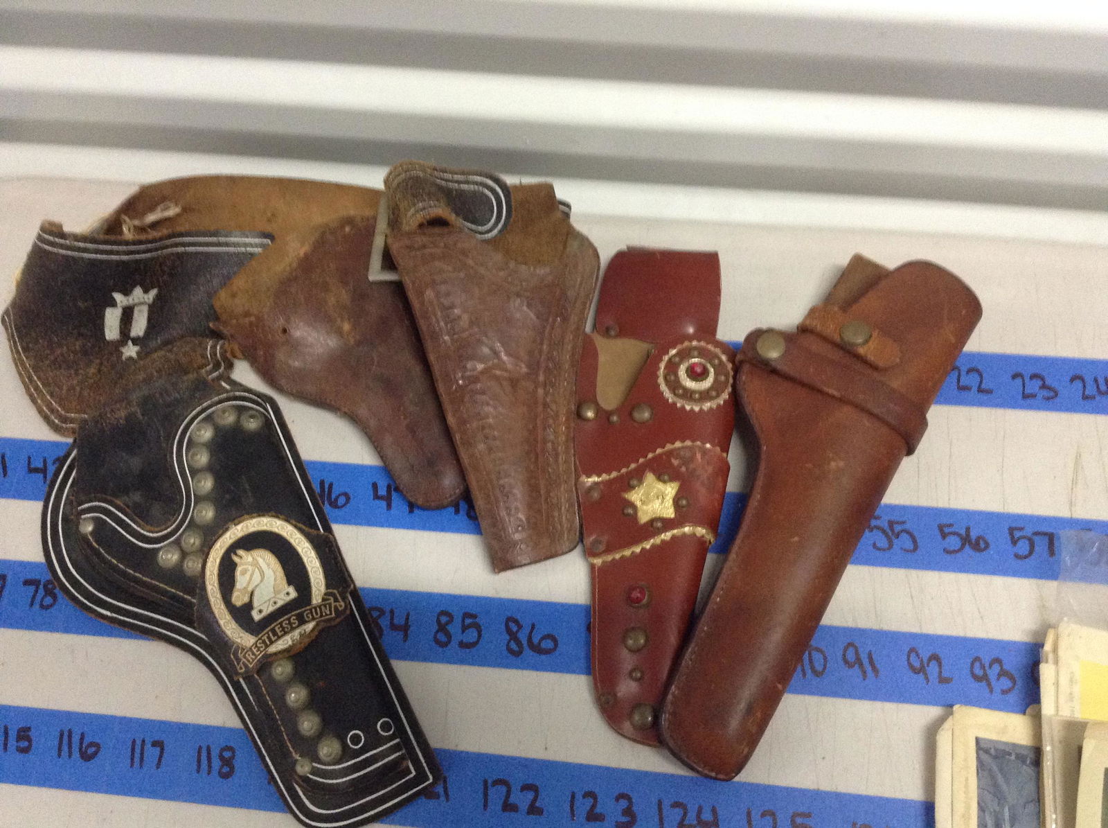 lot of vintage cap gun holders: lot of vintage cap gun holders