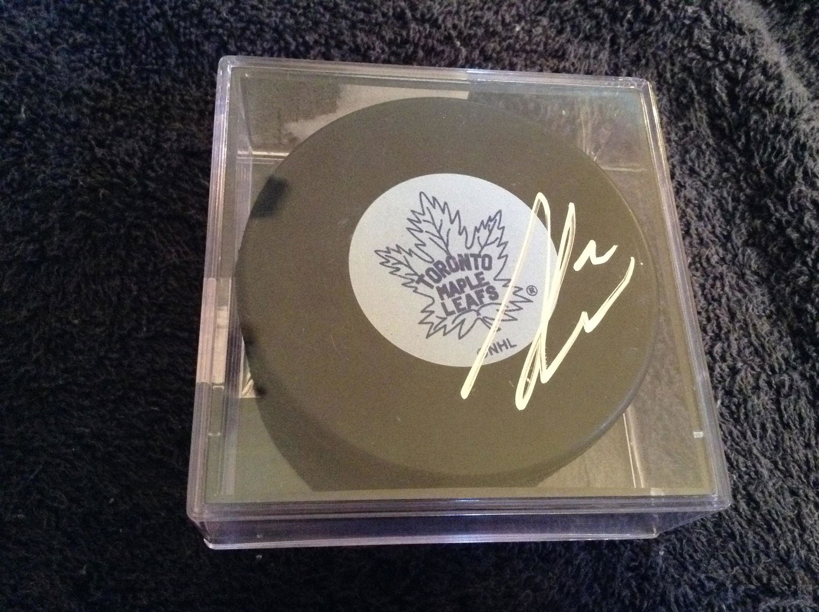 Toronto Maple Leaf's Luke Schenn signed hockey puck (1 of 1)