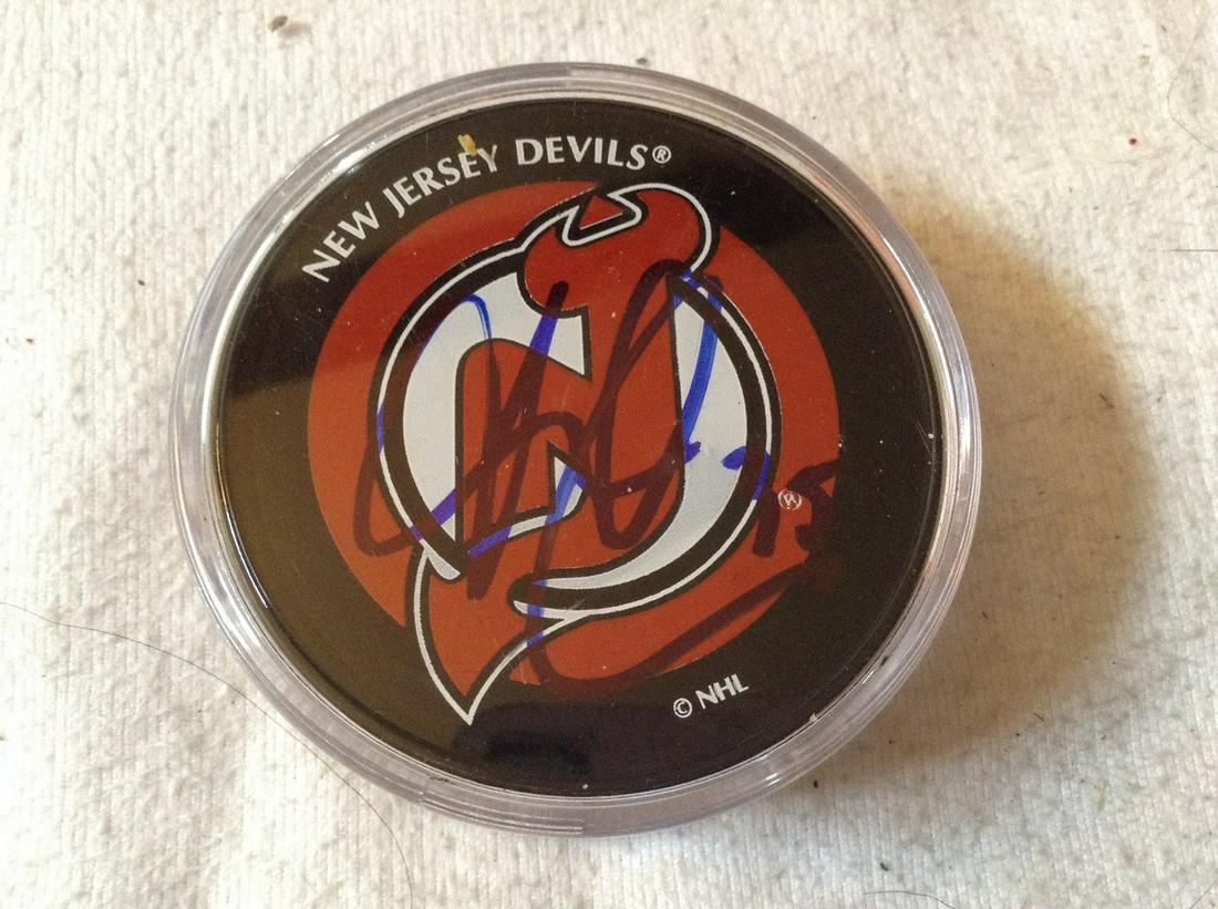 New Jersey Devils Yann Danis signed hockey puck (1 of 1)