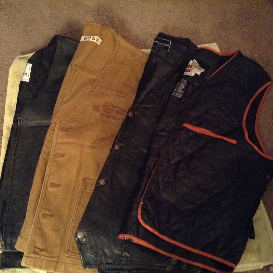 four Harley and other motorcycle vests: size 2x,3x, and 54