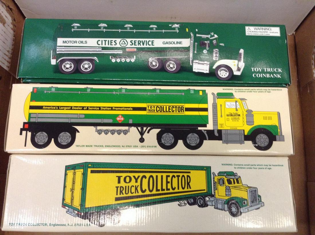 lot of two die cast toy trucks and one toy truck coin (1 of 1)
