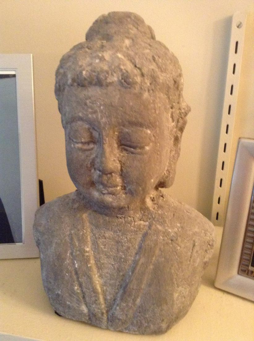 pottery buddha measures 10" tall: pottery buddha measures 10" tall
