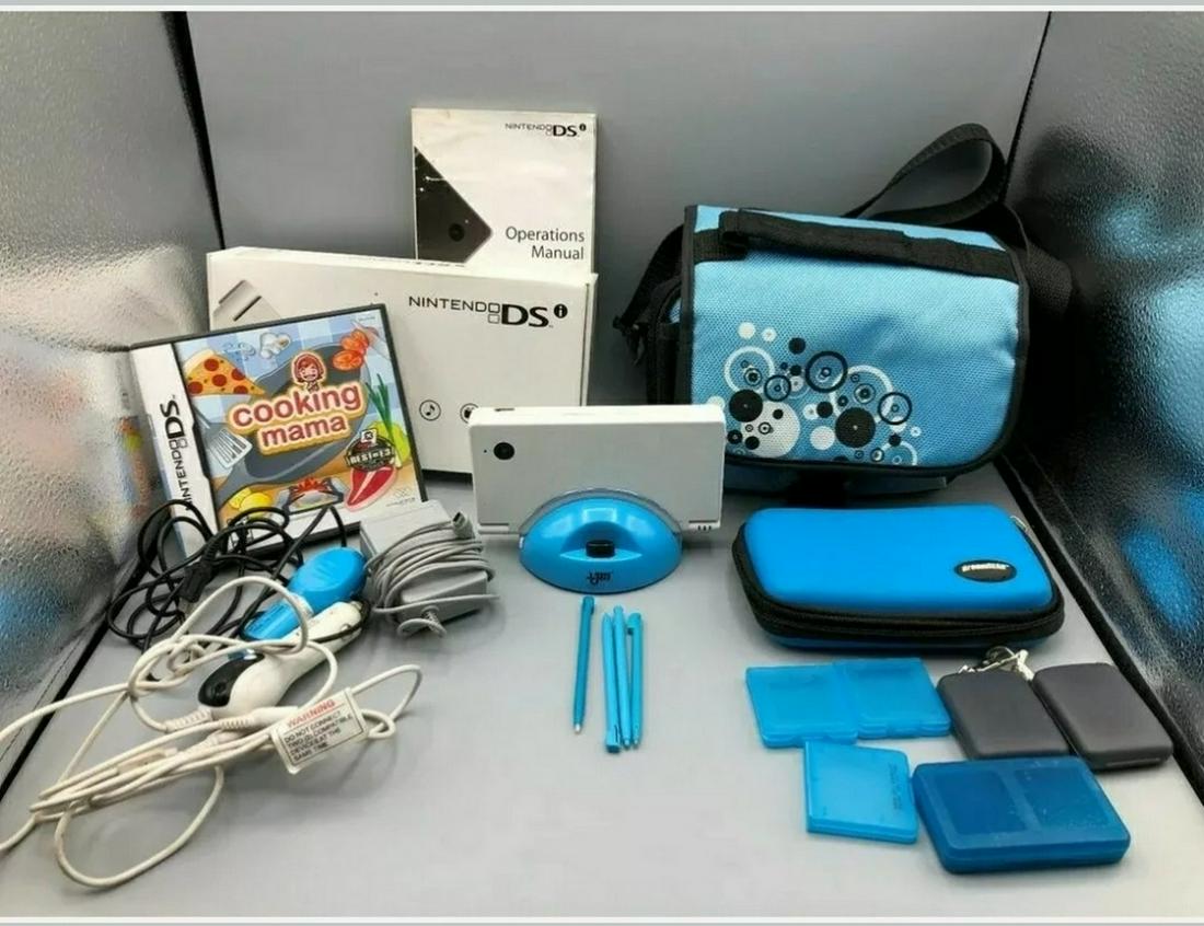 Nintendo DSI with original box, charger, cases, and: Nintendo DSI with original box, charger, cases, and accessorries- - tested in working condition