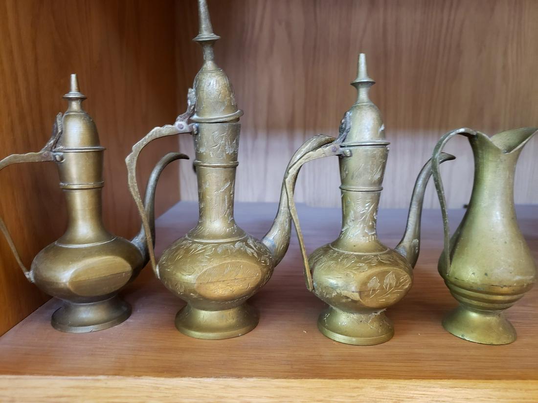 Four vintage solid brass teapots: Four vintage solid brass teapots