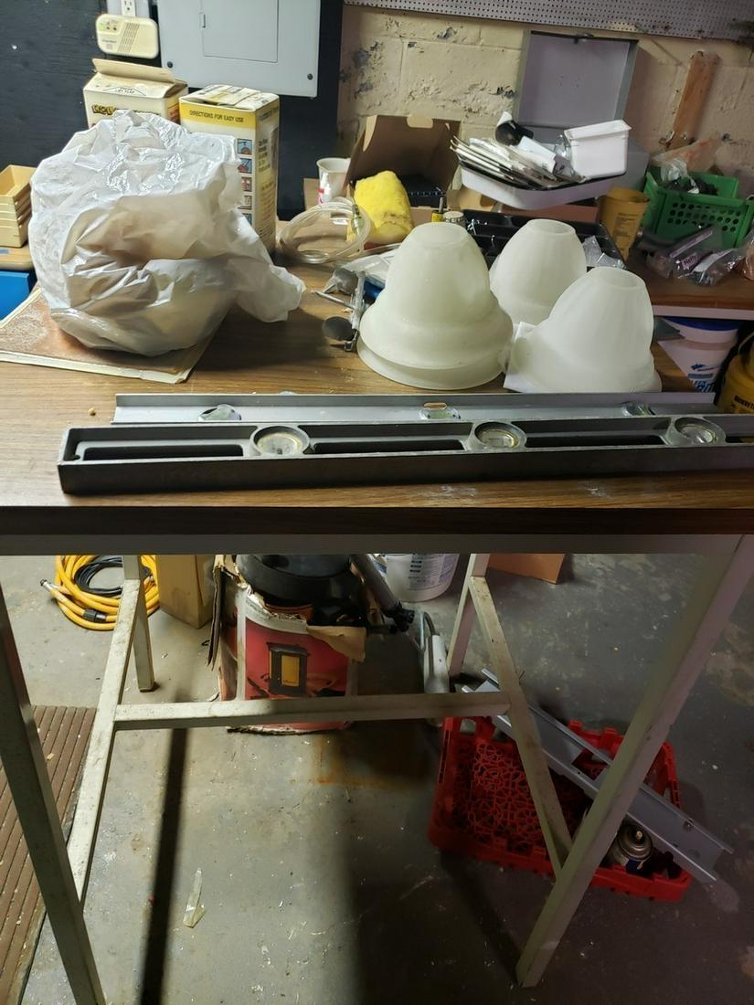 Workroom table with miscellaneous supplies: Workroom table with miscellaneous supplies