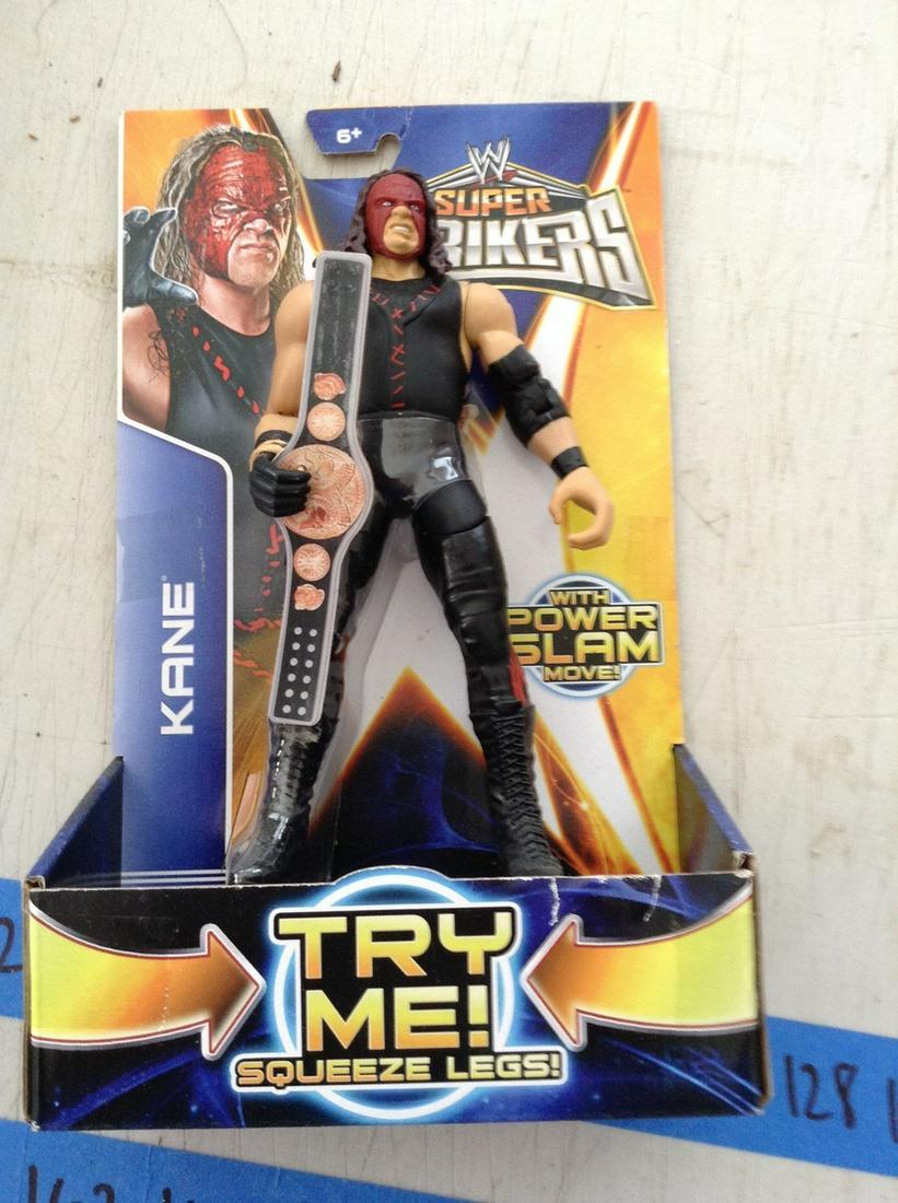 wwe super striker Kane action figure in package: wwe super striker Kane action figure in package