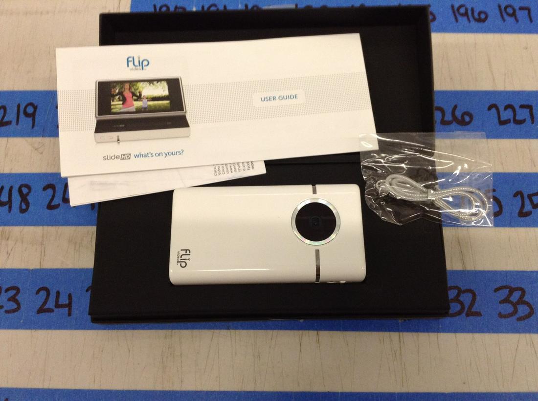 flip camera with case and paperwork (1 of 1)