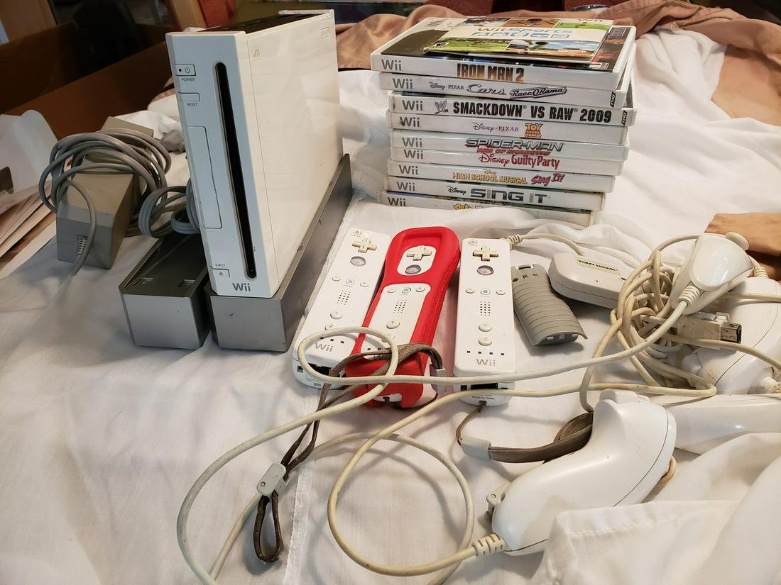 Wii console with a/c cord, games, three joysticks, 4 (1 of 1)