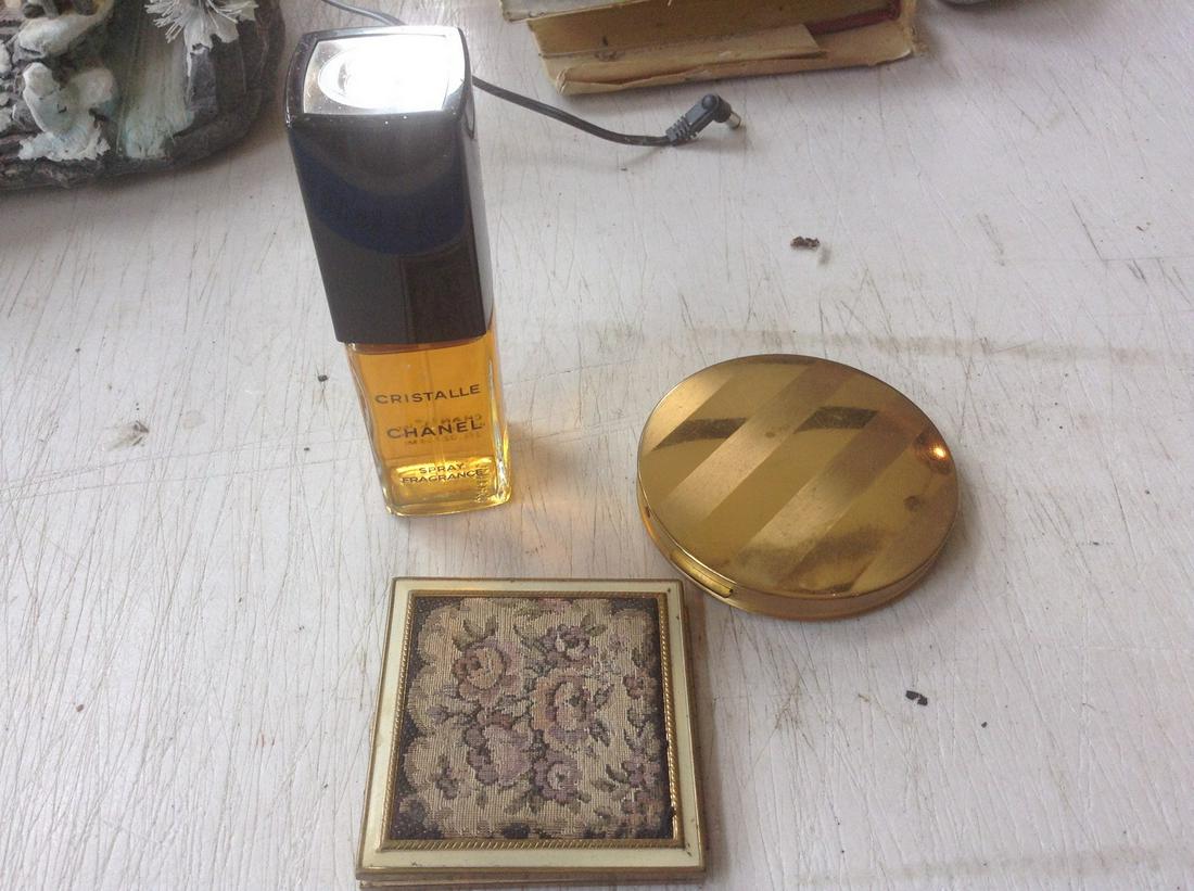 bottle of chanel and vintage compacts: bottle of chanel and vintage compacts