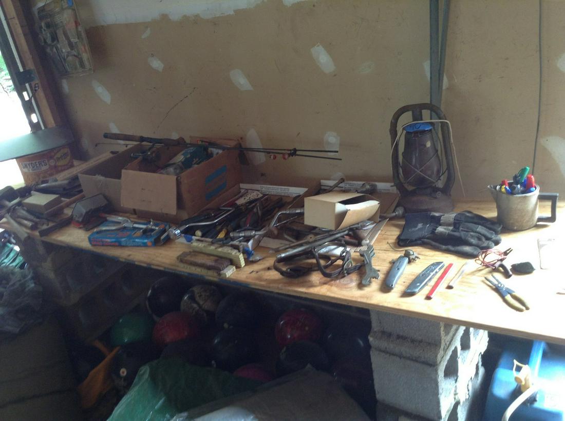 large amount of tools on top. of workbench (1 of 1)