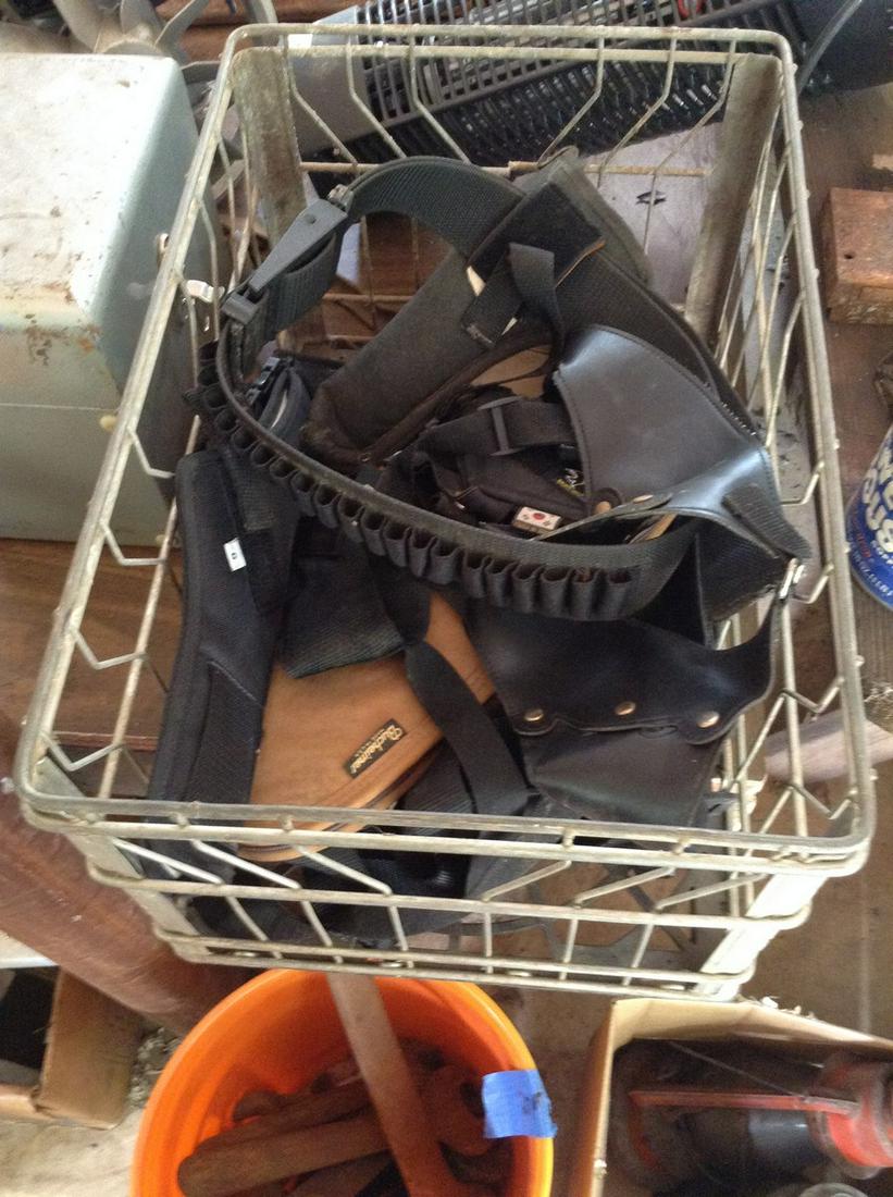 milk crate full of gun holsters and belts: milk crate full of gun holsters and belts