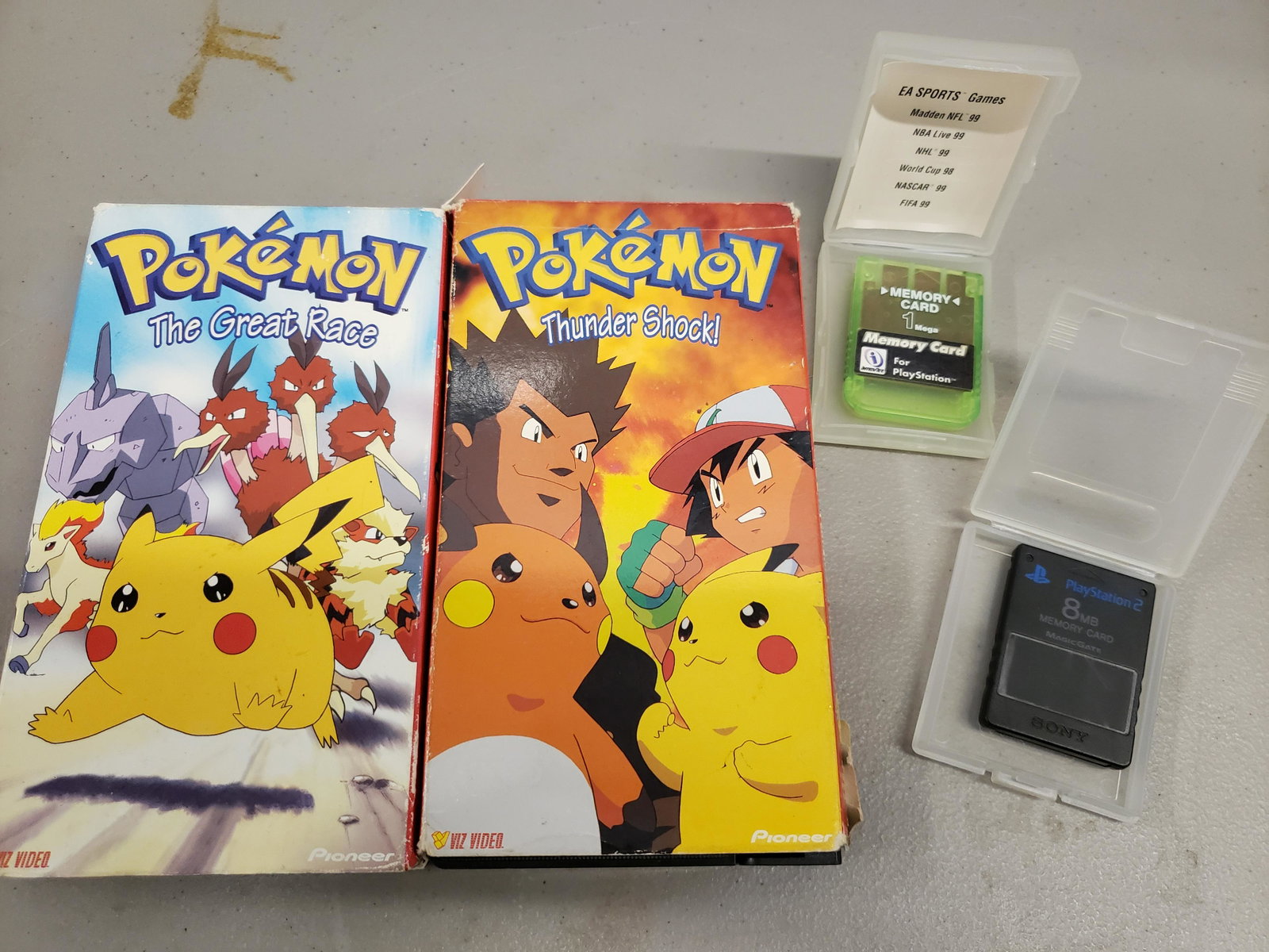 early Pokemon VHS tapes and video game memory cards: early Pokemon VHS tapes and video game memory cards