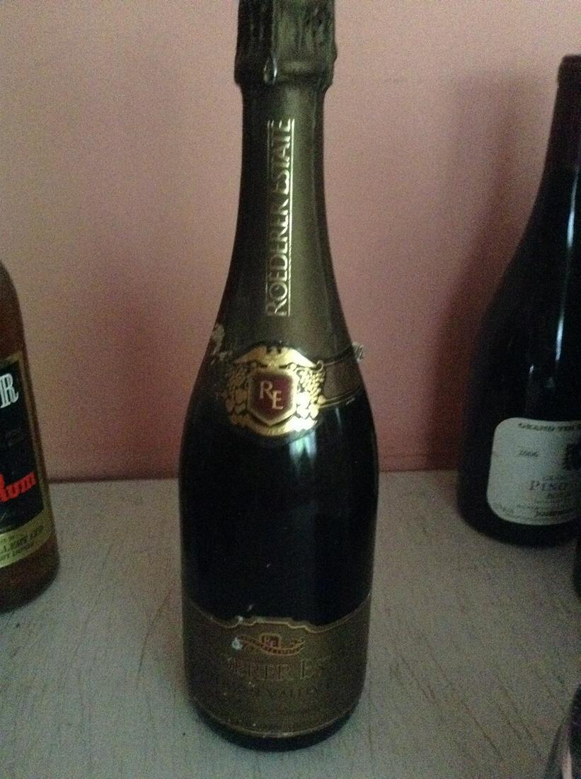 Roederer Estate 750 ml: Any contents in bottle is Free; You are bidding on the bottle & unbroken tax stamp
