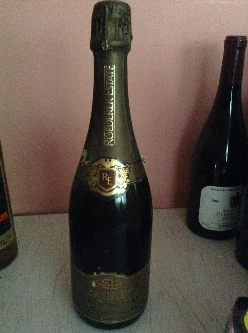 Roederer Estate 750 ml: Any contents in bottle is Free; You are bidding on the bottle & unbroken tax stamp