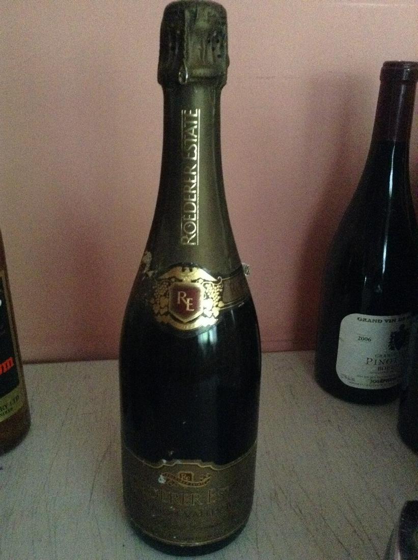 Roederer Estate 750 ml: Any contents in bottle is Free; You are bidding on the bottle & unbroken tax stamp