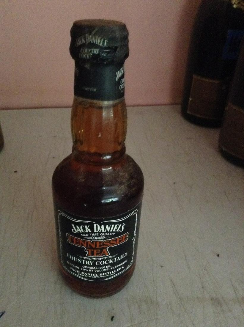 Jack Daniels Tennessee Tea 200 ml: Any contents in bottle is Free; You are bidding on the bottle & unbroken tax stamp
