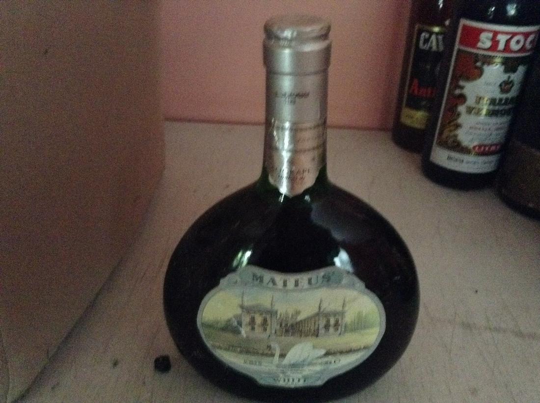 Mateus White Wine 750 ml: Any contents in bottle is Free; You are bidding on the bottle & unbroken tax stamp