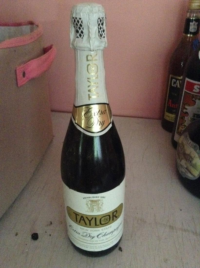 Taylor Extra Dry Champagne 750 ml: Any contents in bottle is Free; You are bidding on the bottle & unbroken tax stamp