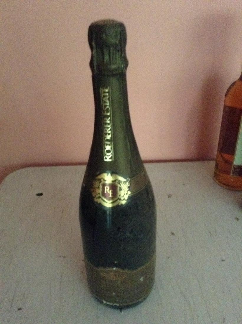 Roederer Estate 750 ml: Any contents in bottle is Free; You are bidding on the bottle & unbroken tax stamp