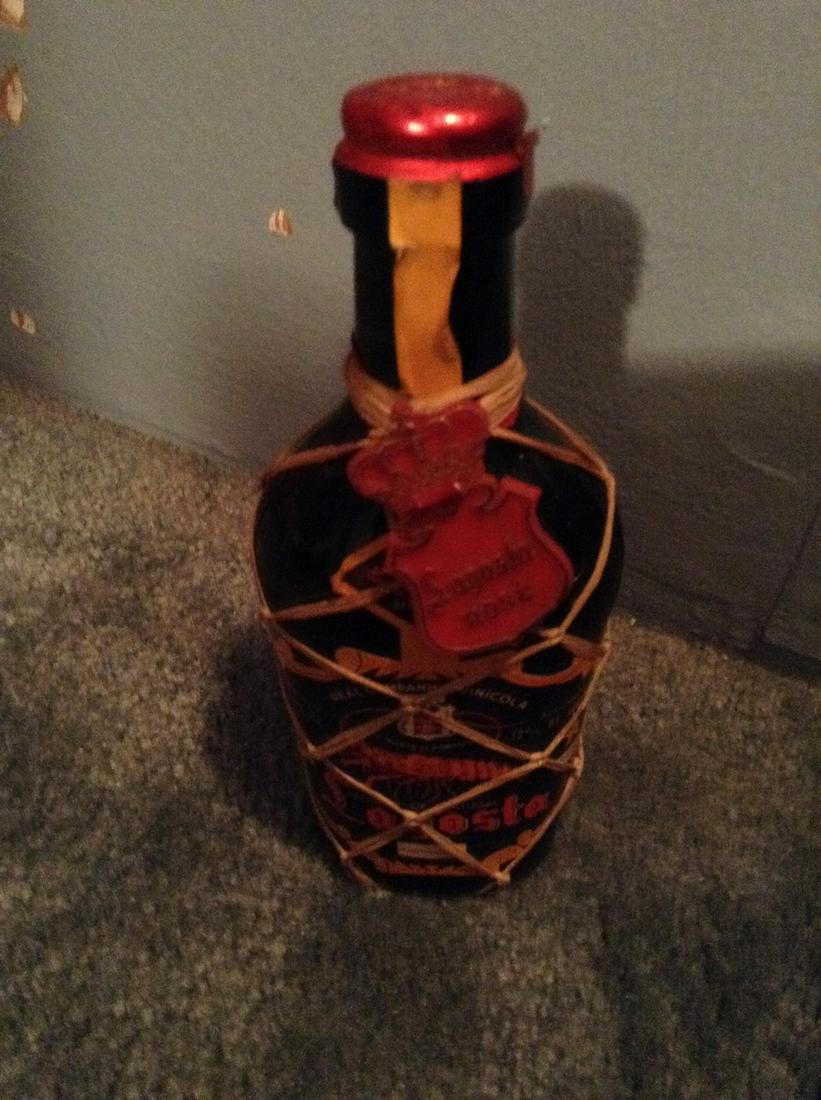 lagosta rose 6.5 fl oz: Any contents in bottle is Free; You are bidding on the bottle & unbroken tax stamp