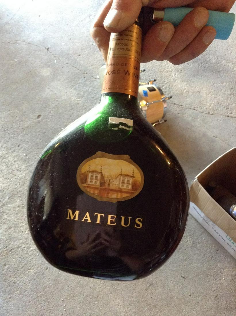 mateus wine: Any contents in bottle is Free; You are bidding on the bottle & unbroken tax stamp