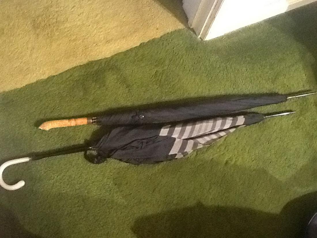 Two vintage umbrellas with unique handles: Two vintage umbrellas with unique handles