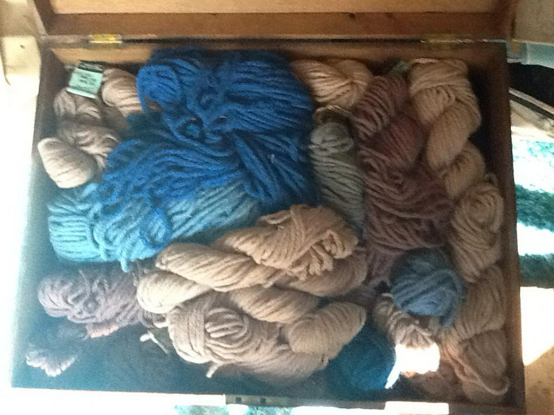 Wooden chest full of yarn: Wooden chest full of yarn
