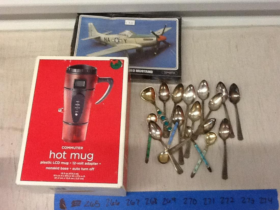 New airplane model and Hot mug with various spoons: New airplane model and Hot mug with various spoons