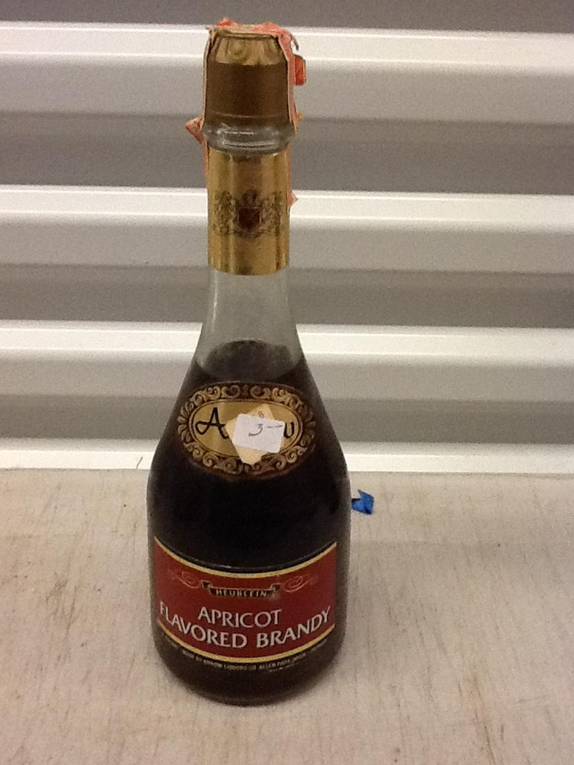 heublein Apricot Flavored Brandy: Any contents in bottle is Free; You are bidding on the bottle & unbroken tax stamp