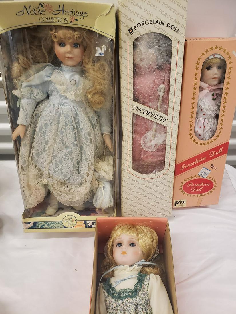 Lot of 4 Porcelain dolls in box (1 of 1)