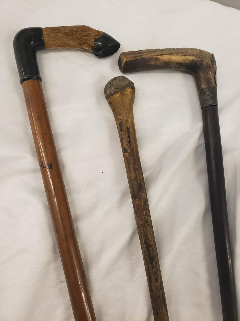 Lot of 3 vintage hand carved canes - one appears to be (1 of 1)
