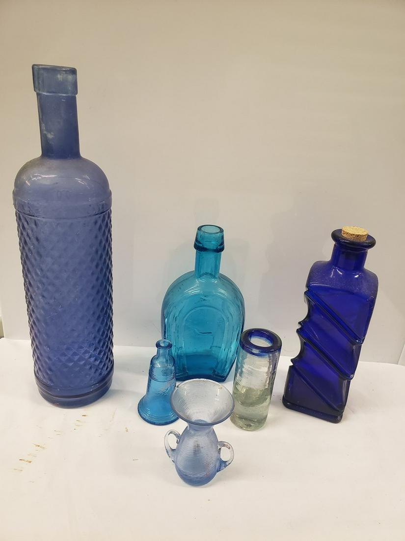 Lot of different blue glass bottles and more: Lot of different blue glass bottles and more