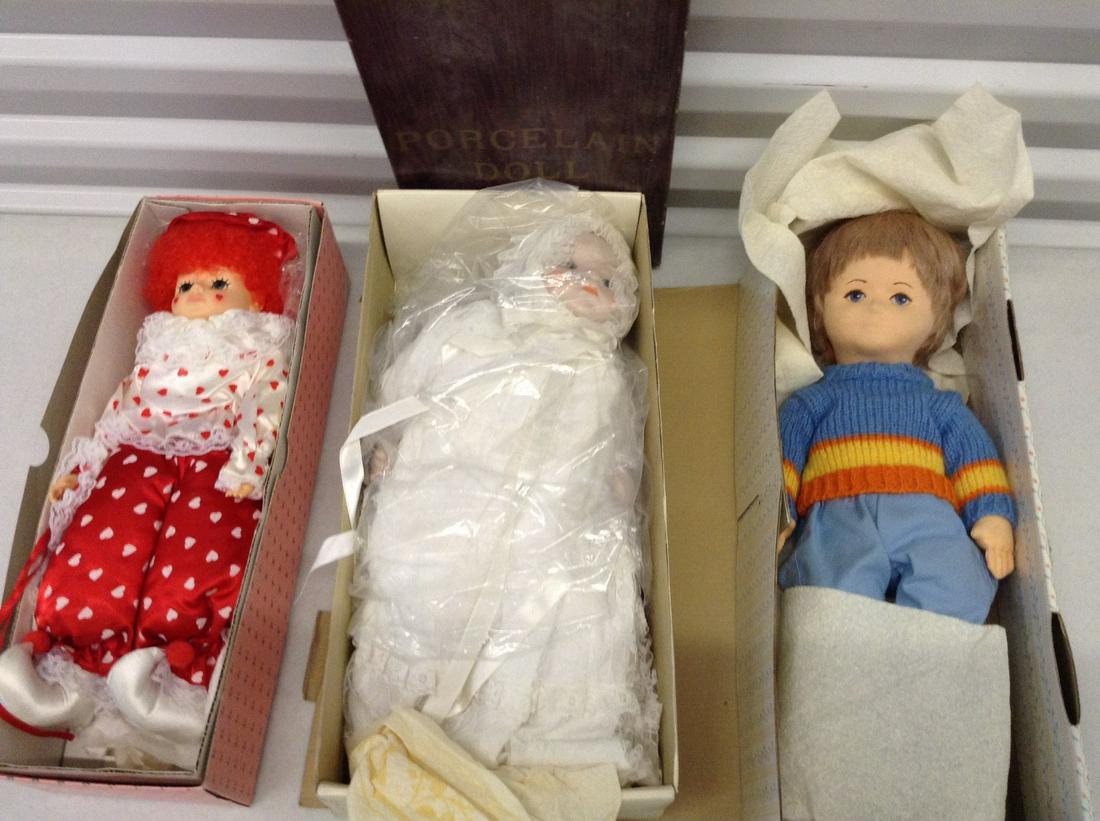 A Connoisseur Collection Doll from Seymour Mann,: A Connoisseur Collection Doll from Seymour Mann, Brinn's, and Porcelain Dolls in boxes