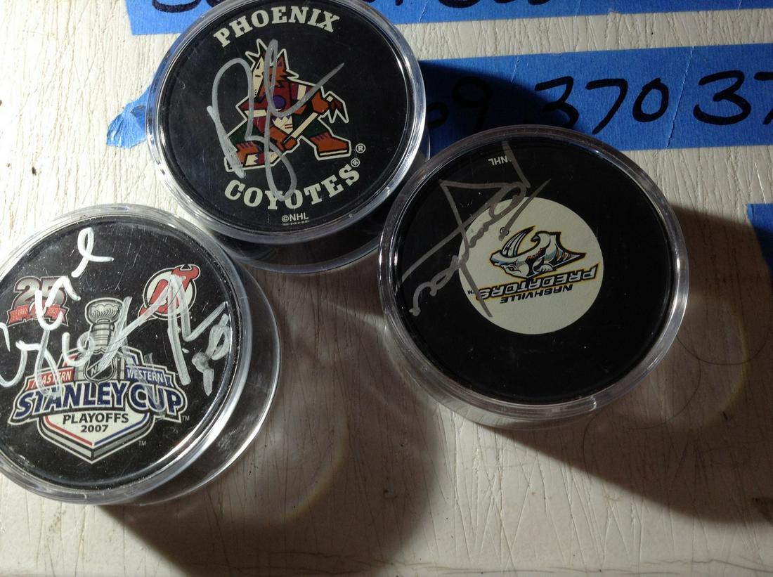 lot of autographed Hockey Pucks: lot of autographed Hockey Pucks