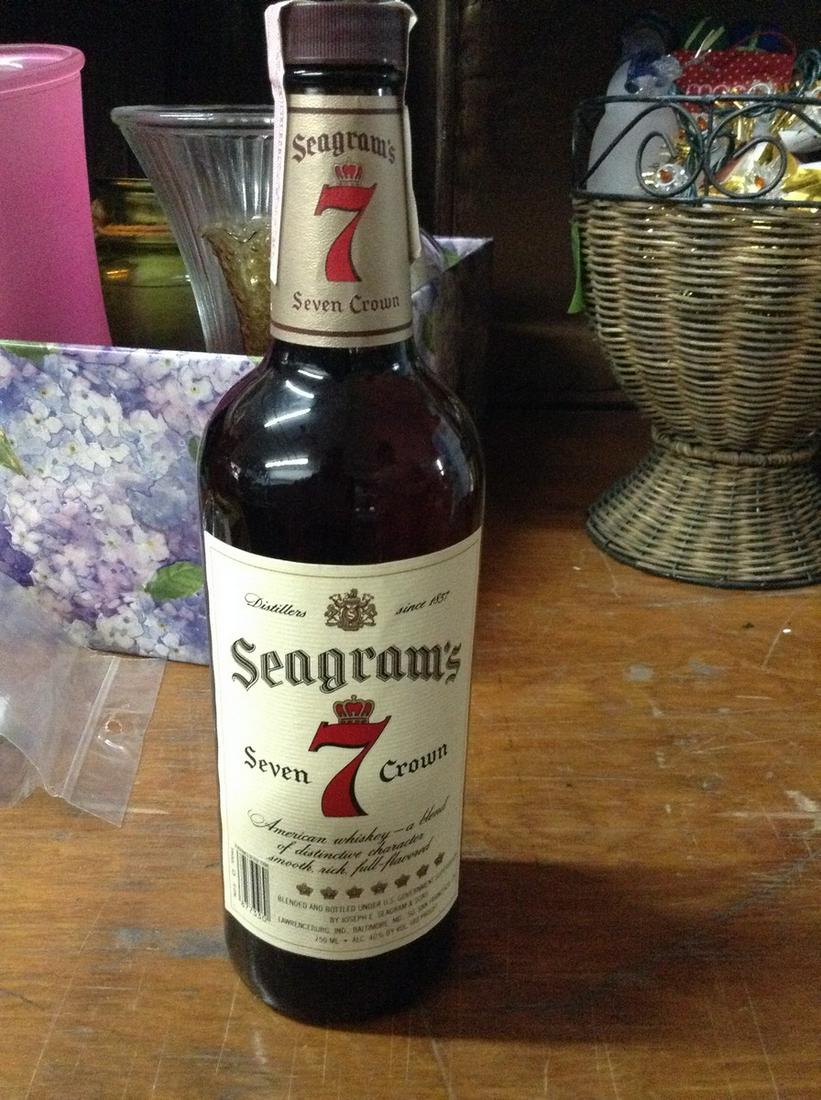 Seagram's Seven: Any contents in bottle is Free; You are bidding on the bottle & unbroken tax stamp