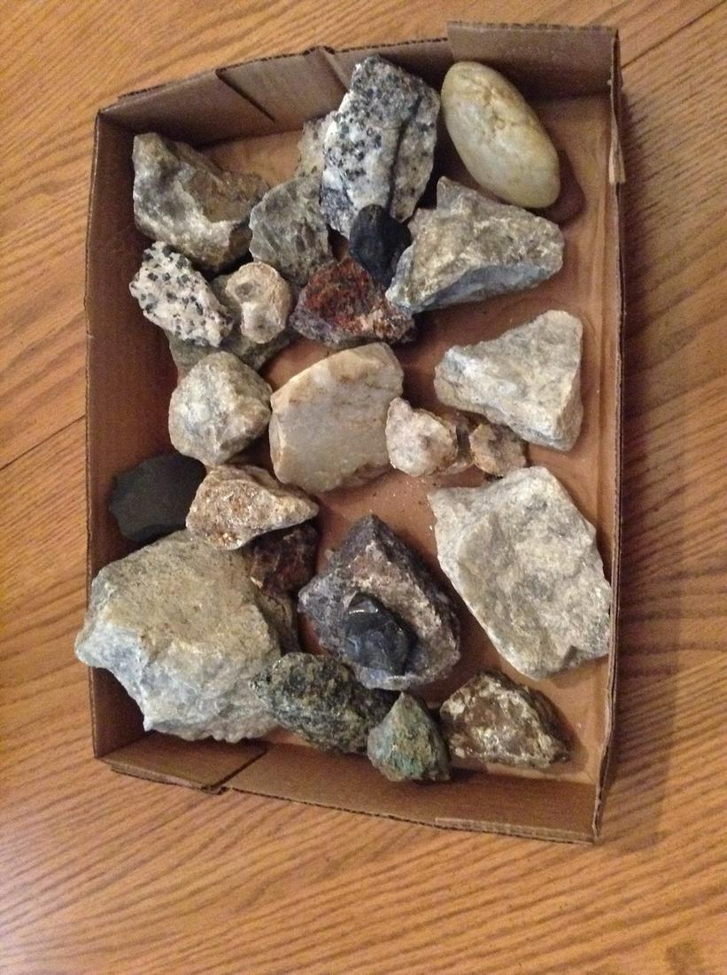 Box full of minerals and polished rock: Box full of minerals and polished rock