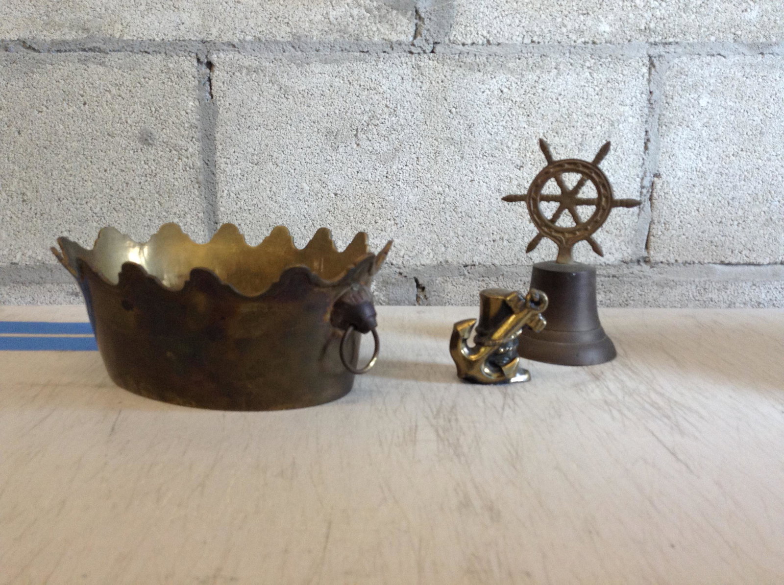 Brass ships wheel bell and other brass items: Brass ships wheel bell and other brass items