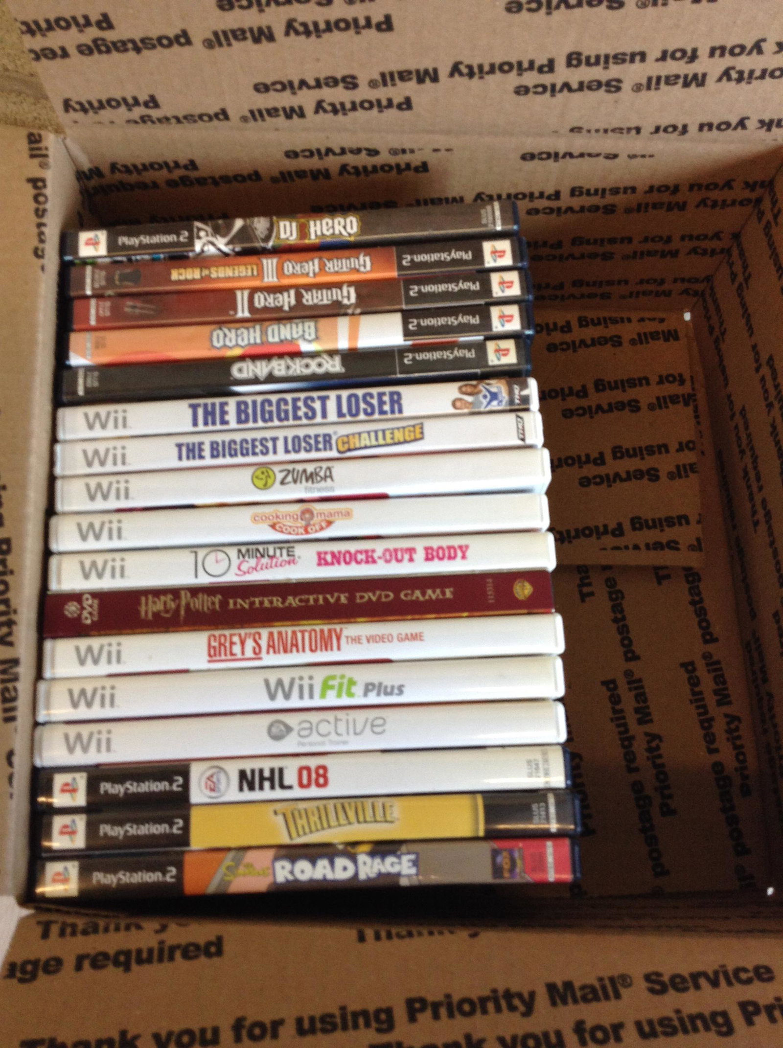 Box full of Playstation and Wii games: Box full of Playstation and Wii games