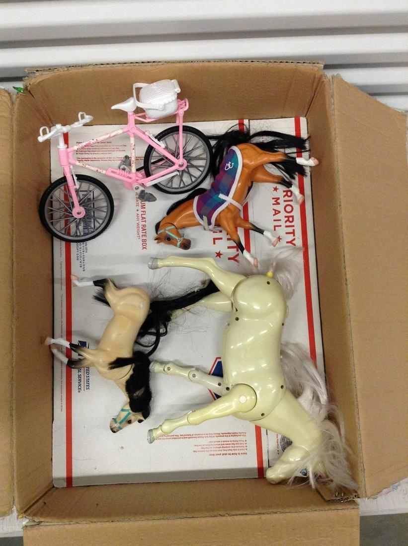 Lot of toy horses and Barbie bike: Lot of toy horses and Barbie bike