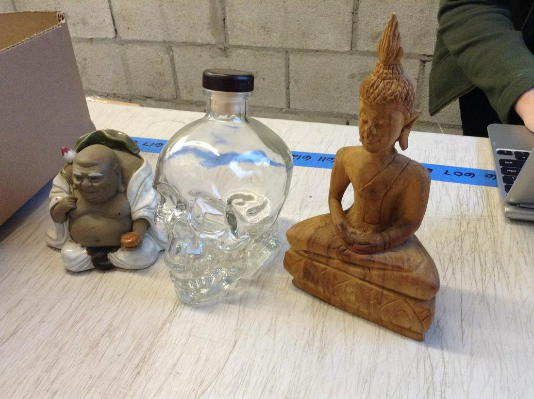 Empty Crystal Head Vodka Bottle and Two Buddhas (1 of 1)