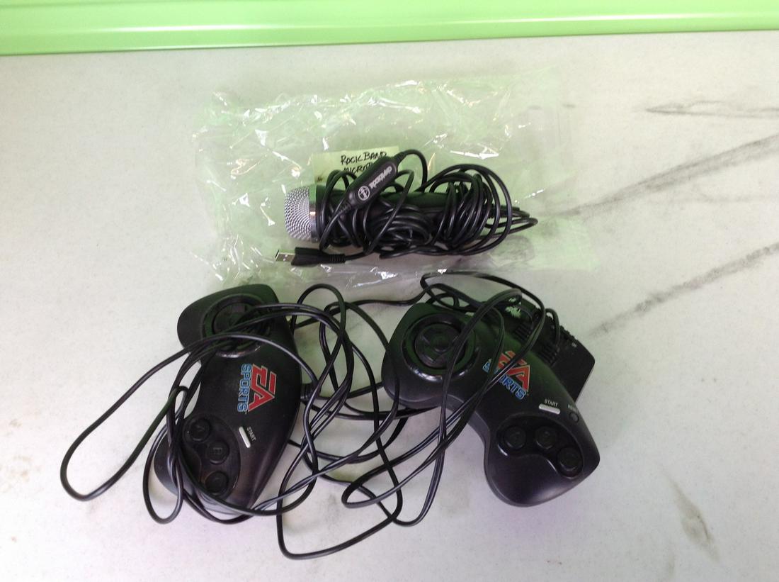 Lot of video game controllers and rock band microphone (1 of 1)