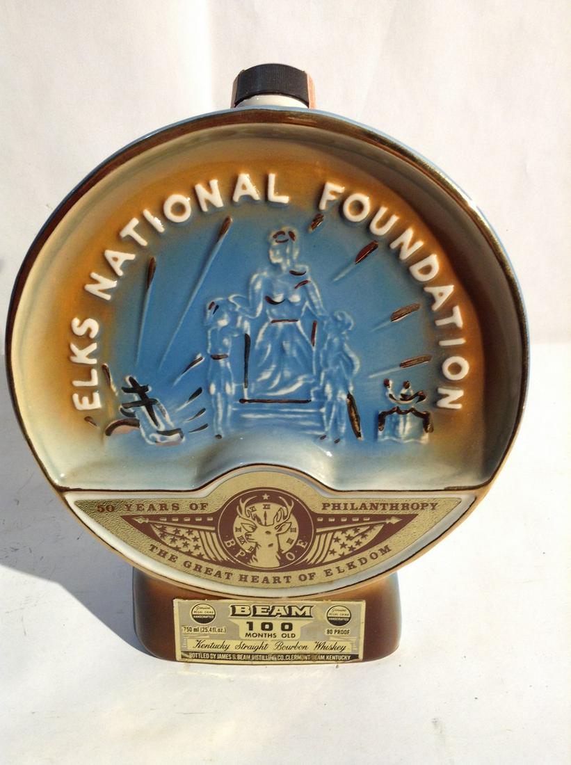 Jim Beam Decanter: Any contents in bottle is Free; You are bidding on the bottle & unbroken tax stamp