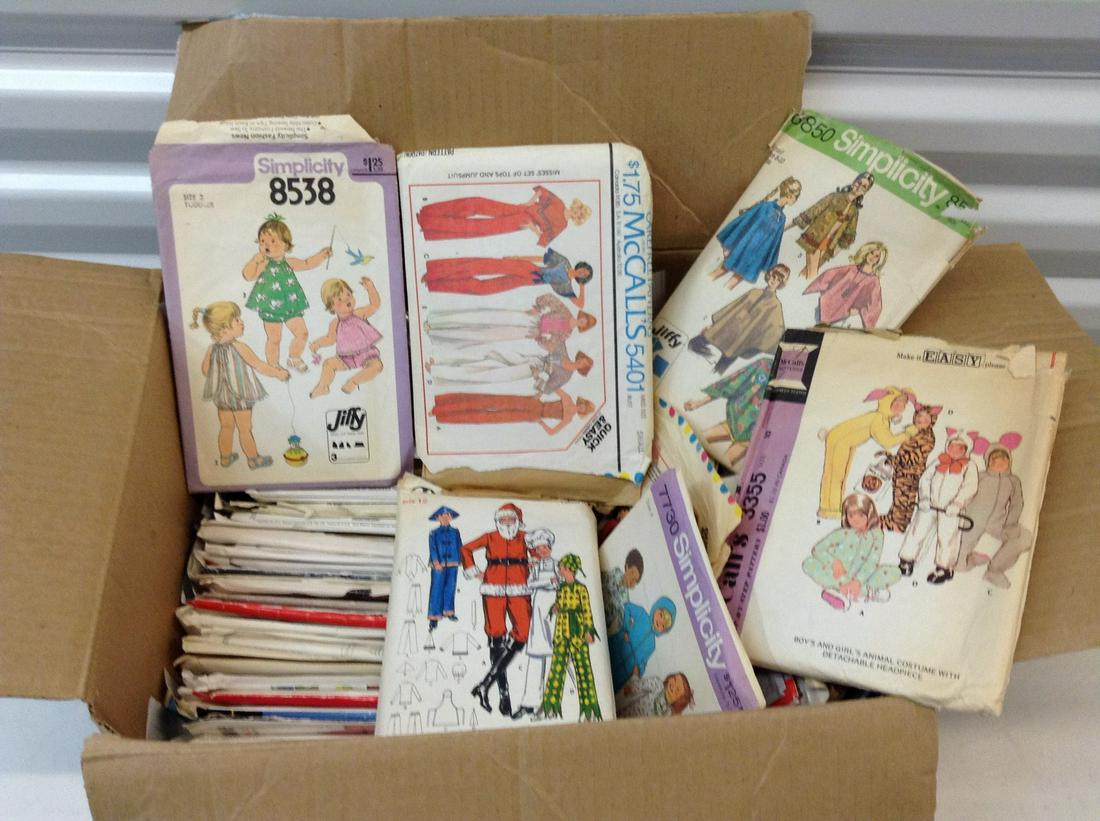 Box full of vintage sewing patterns: Box full of vintage sewing patterns