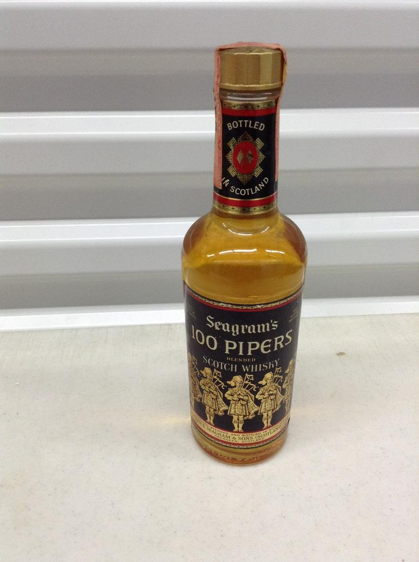 Seagrams 100 Pipers Scotch unbroken tax seal: Any contents in bottle is Free; You are bidding on the bottle & unbroken tax stamp