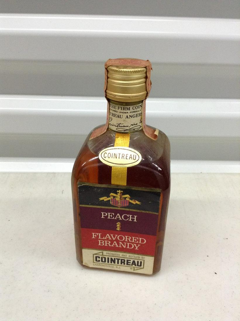 Cointreau Brandy unbroken tax seal: Any contents in bottle is Free; You are bidding on the bottle & unbroken tax stamp