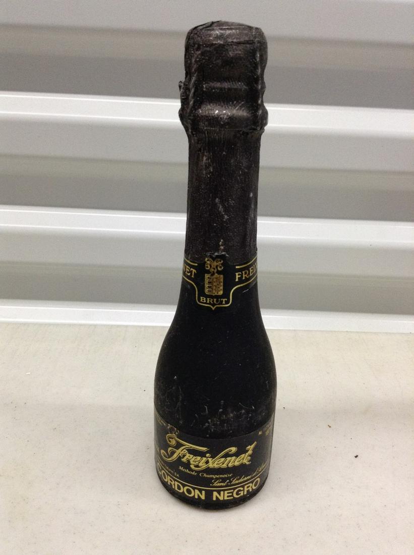 Freixenet Cordon Negro: Any contents in bottle is Free; You are bidding on the bottle & unbroken tax stamp