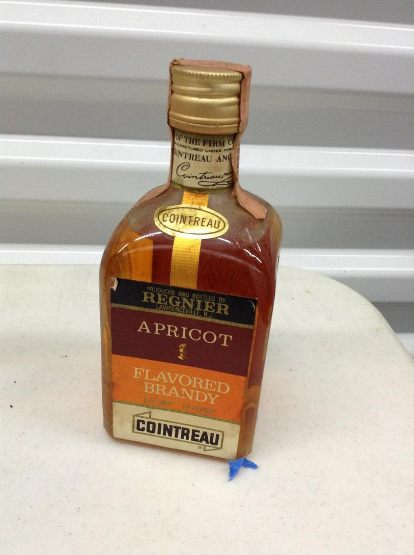 Cointreau Brandy unbroken tax seal: Any contents in bottle is Free; You are bidding on the bottle & unbroken tax stamp