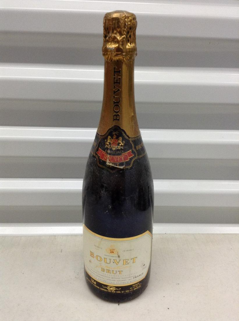 Bouvet champagne: Any contents in bottle is Free; You are bidding on the bottle & unbroken tax stamp